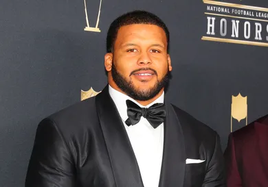 Aaron Donald in a black tuxedo at the NFL Honors red carpet event